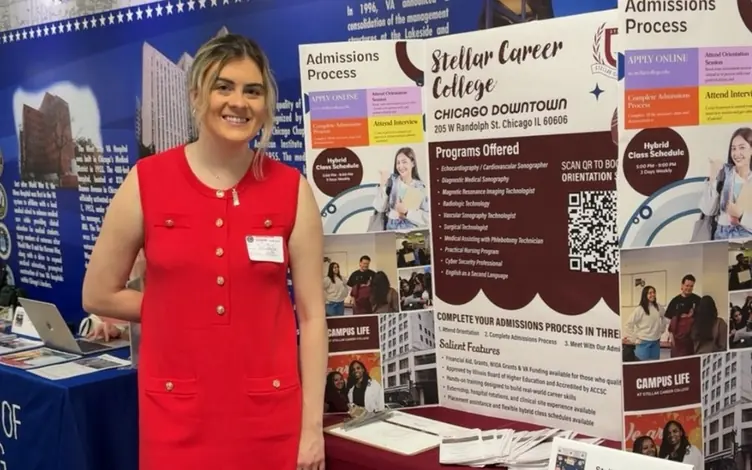 Stellar Career College admissions representative at the Stellar booth during the Education Fair at Jesse Brown VA Medical Center in Chicago